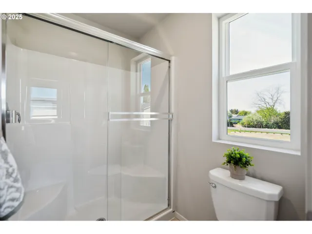 a view of a backyard with wooden fence