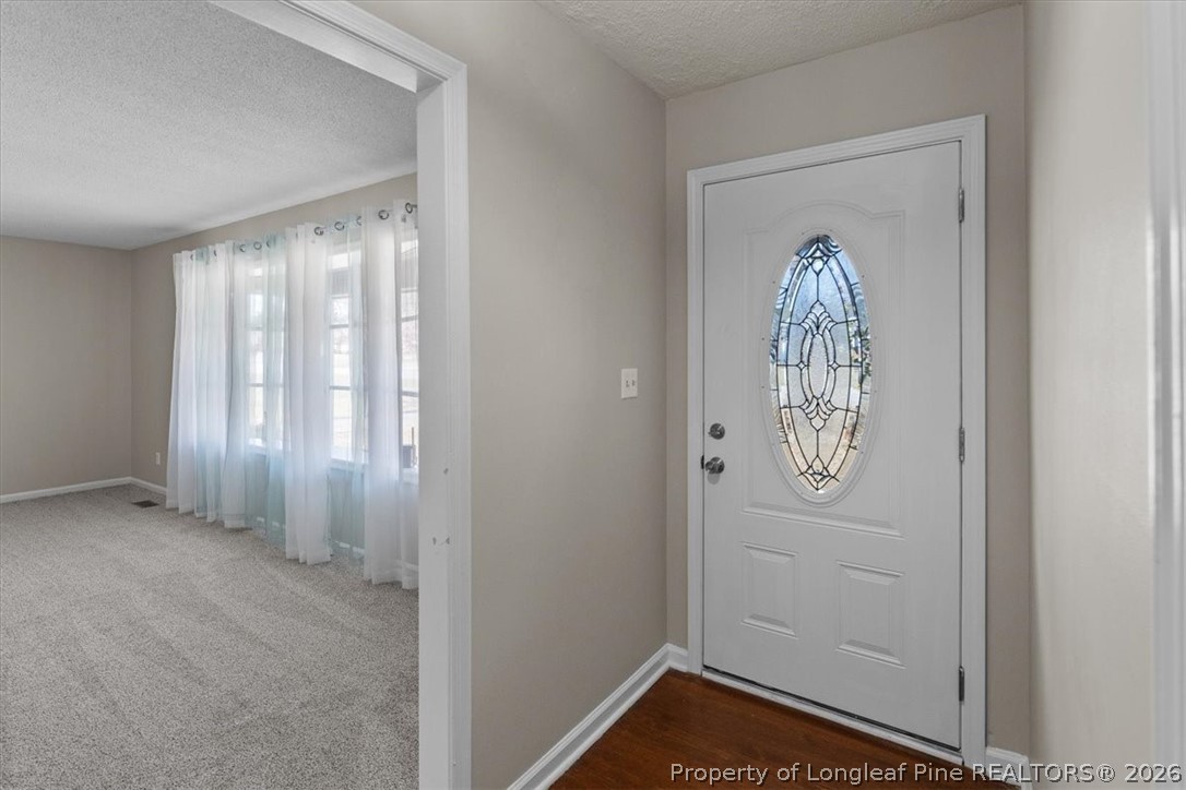 630 Bedford Road Fayetteville, NC 28303 - Photo 3 of 21 a view of front door with wooden floor