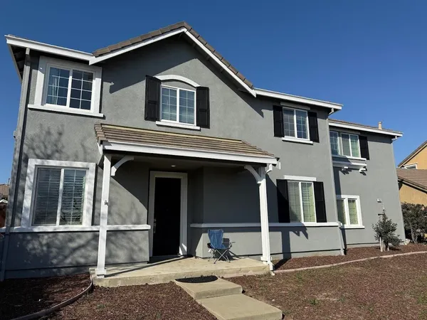 a front view of a house with a garage