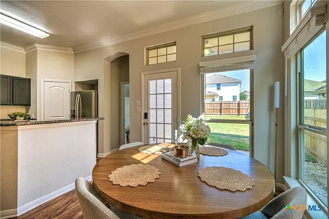 a view of a livingroom with furniture window and wooden floor