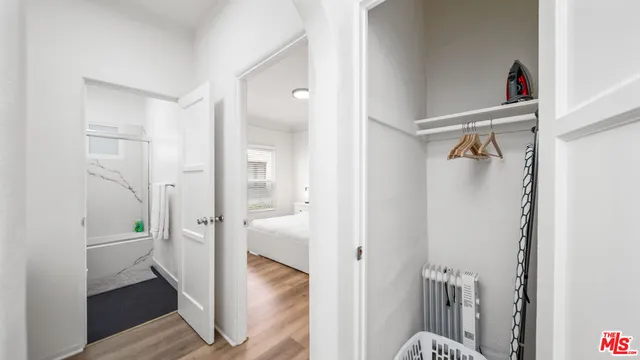 a bathroom with a shower and a sink