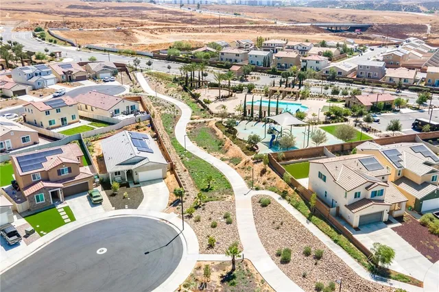 an aerial view of residential houses with outdoor space