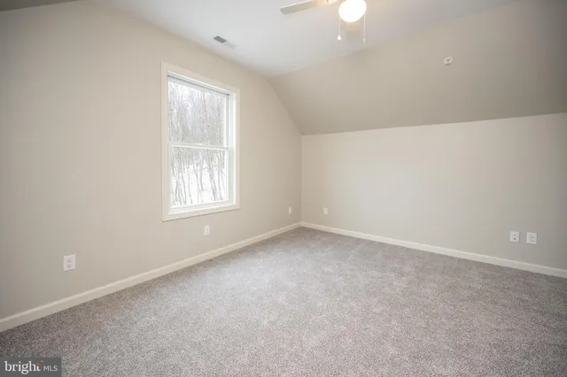 a view of an empty room with a balcony
