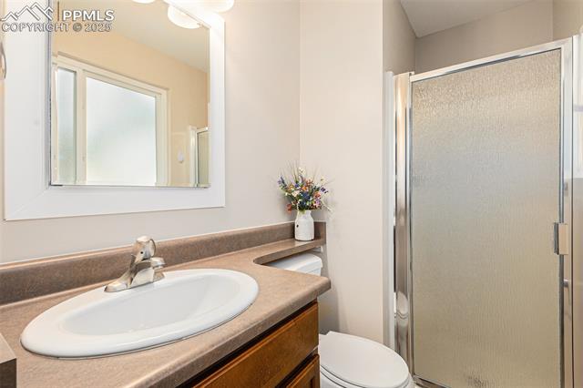 4514 Ridgeglen Road Colorado Springs, CO 80918 - Photo 20 of 29 Full bathroom featuring vanity and shower