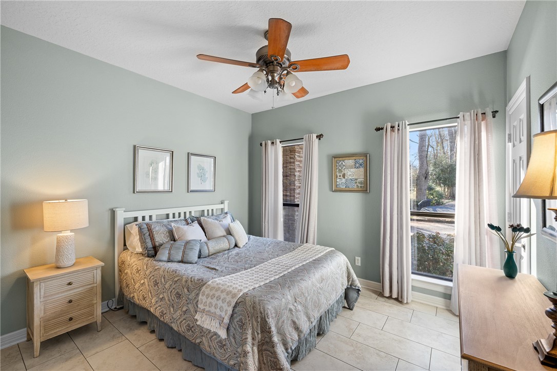 2250 Dillard Road Washington, TX 77880 - Photo 20 of 50 a bedroom with a bed and a chandelier