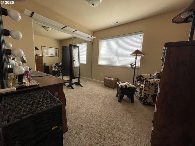 a bed room with furniture and a window