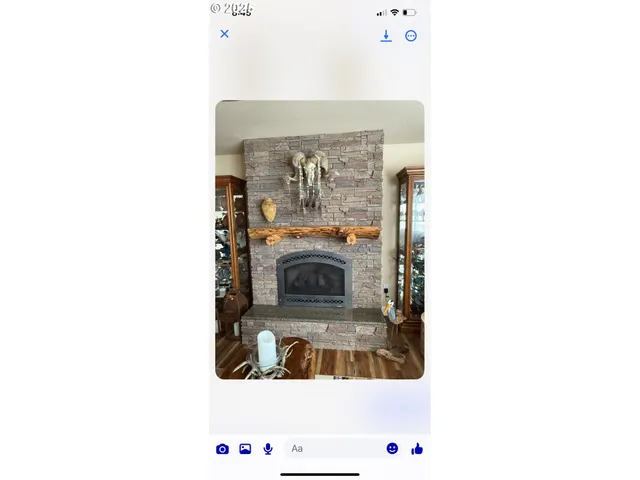 a view of living room with a fireplace