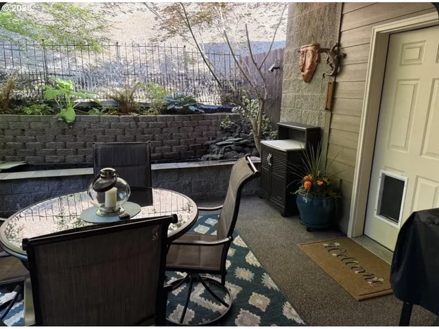 a view of a dinning table and chairs in patio
