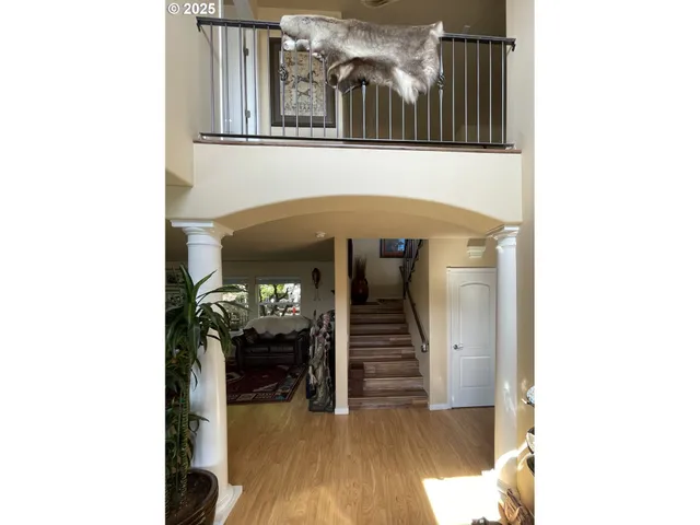 a view of a hallway with seating area