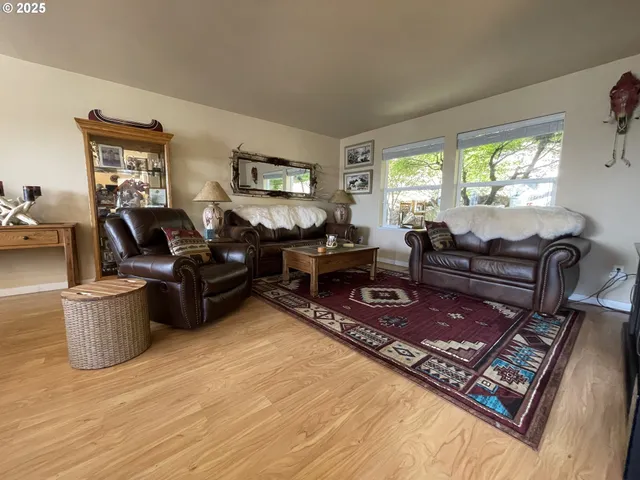 a living room with furniture rug and window