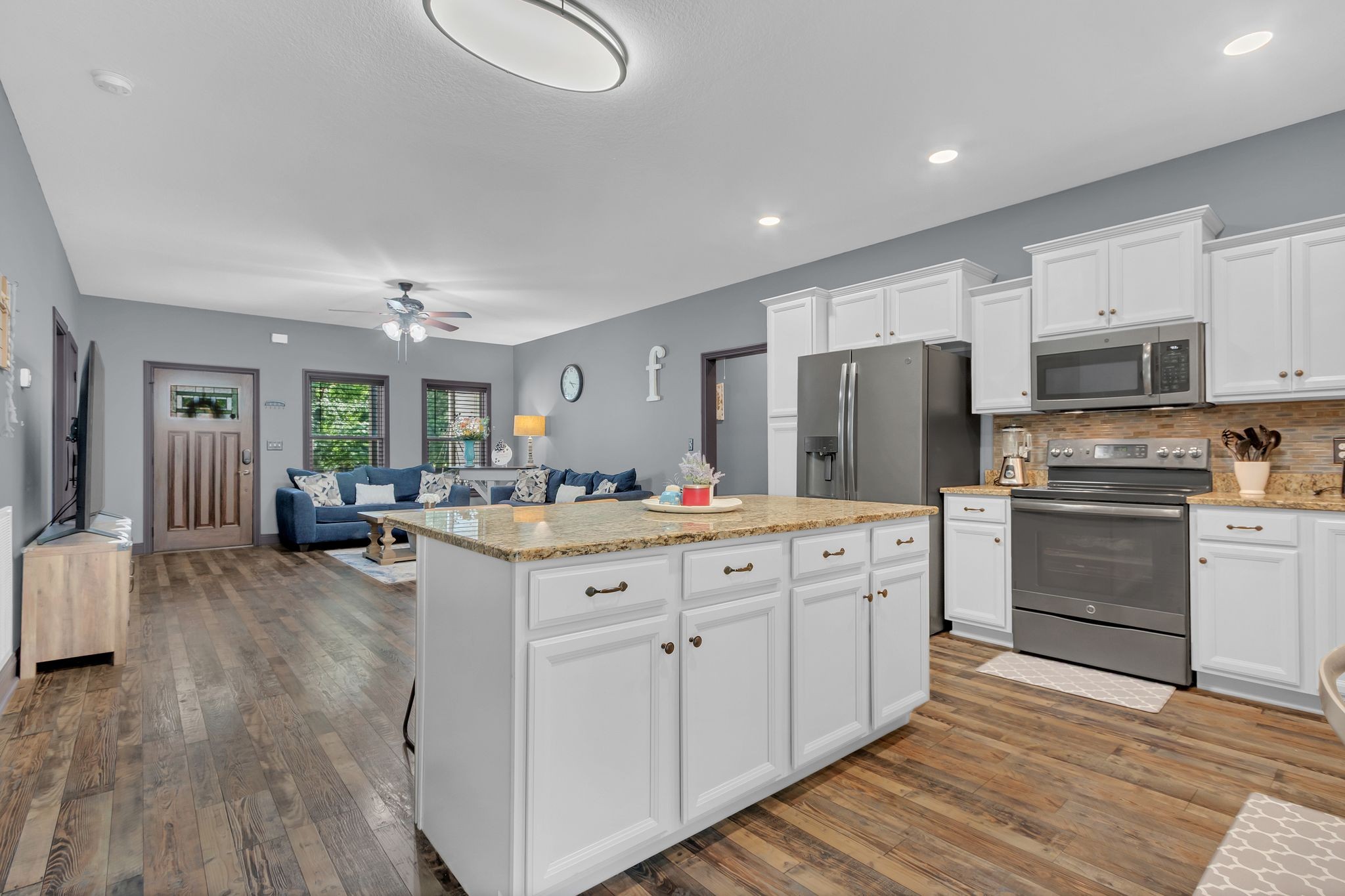 1027 Garton Road Burns, TN 37029 - Photo 14 of 36 a kitchen with kitchen island a sink cabinets and stainless steel appliances