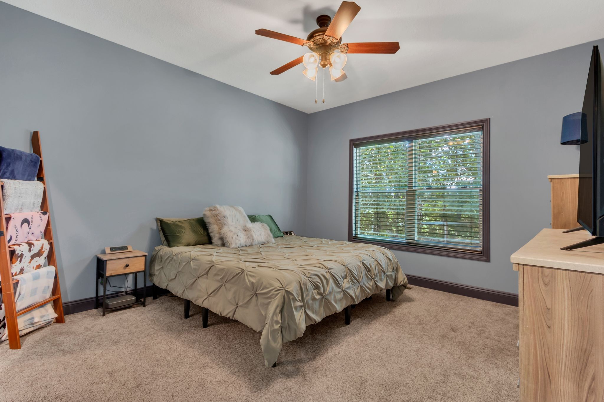 1027 Garton Road Burns, TN 37029 - Photo 17 of 36 a bedroom with a bed and a chandelier