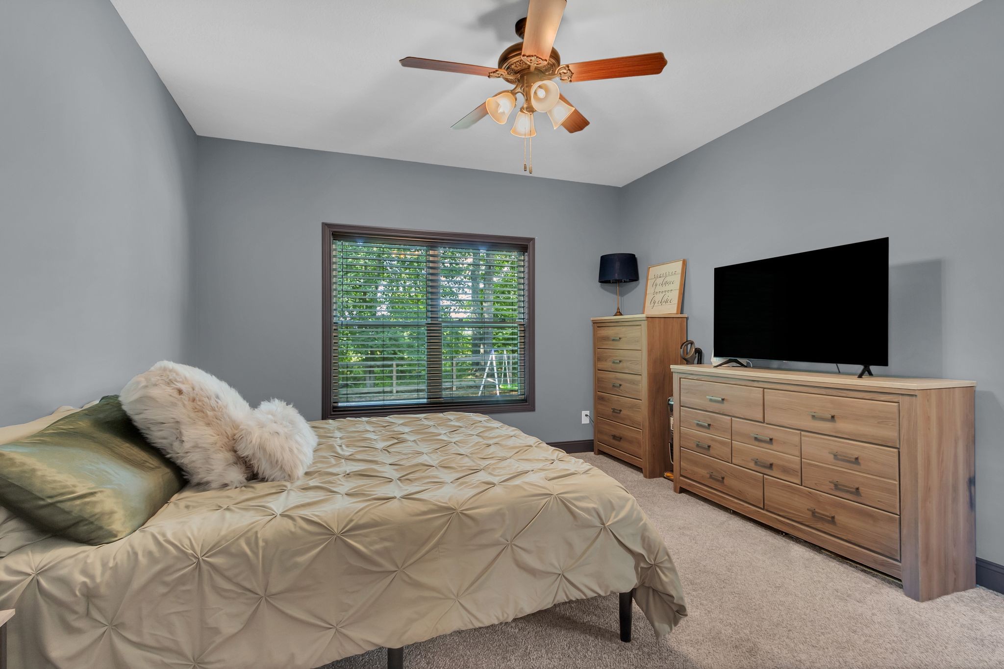 1027 Garton Road Burns, TN 37029 - Photo 18 of 36 a bedroom with a bed and a flat screen tv
