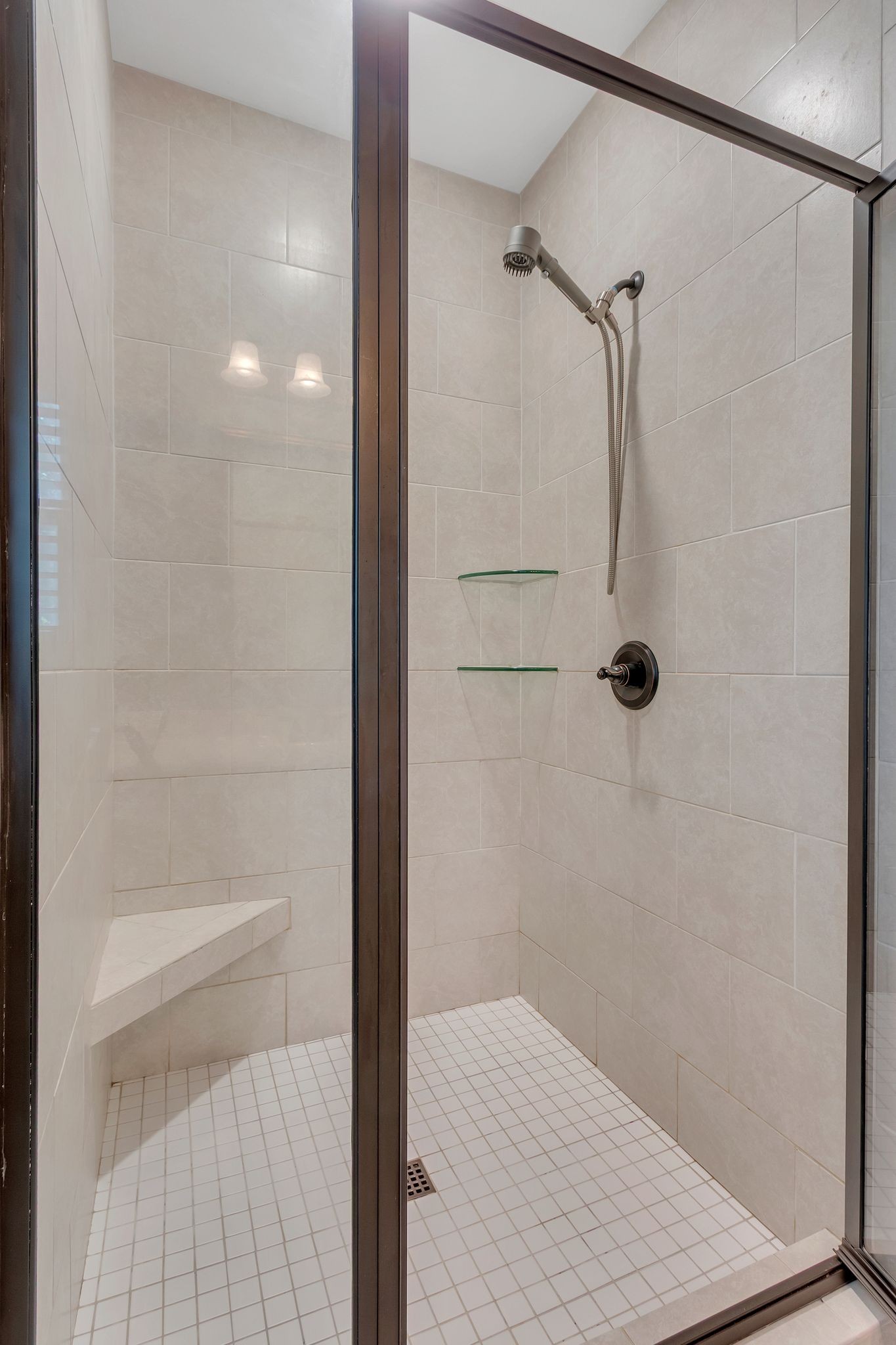 1027 Garton Road Burns, TN 37029 - Photo 21 of 36 a bathroom with a glass shower door