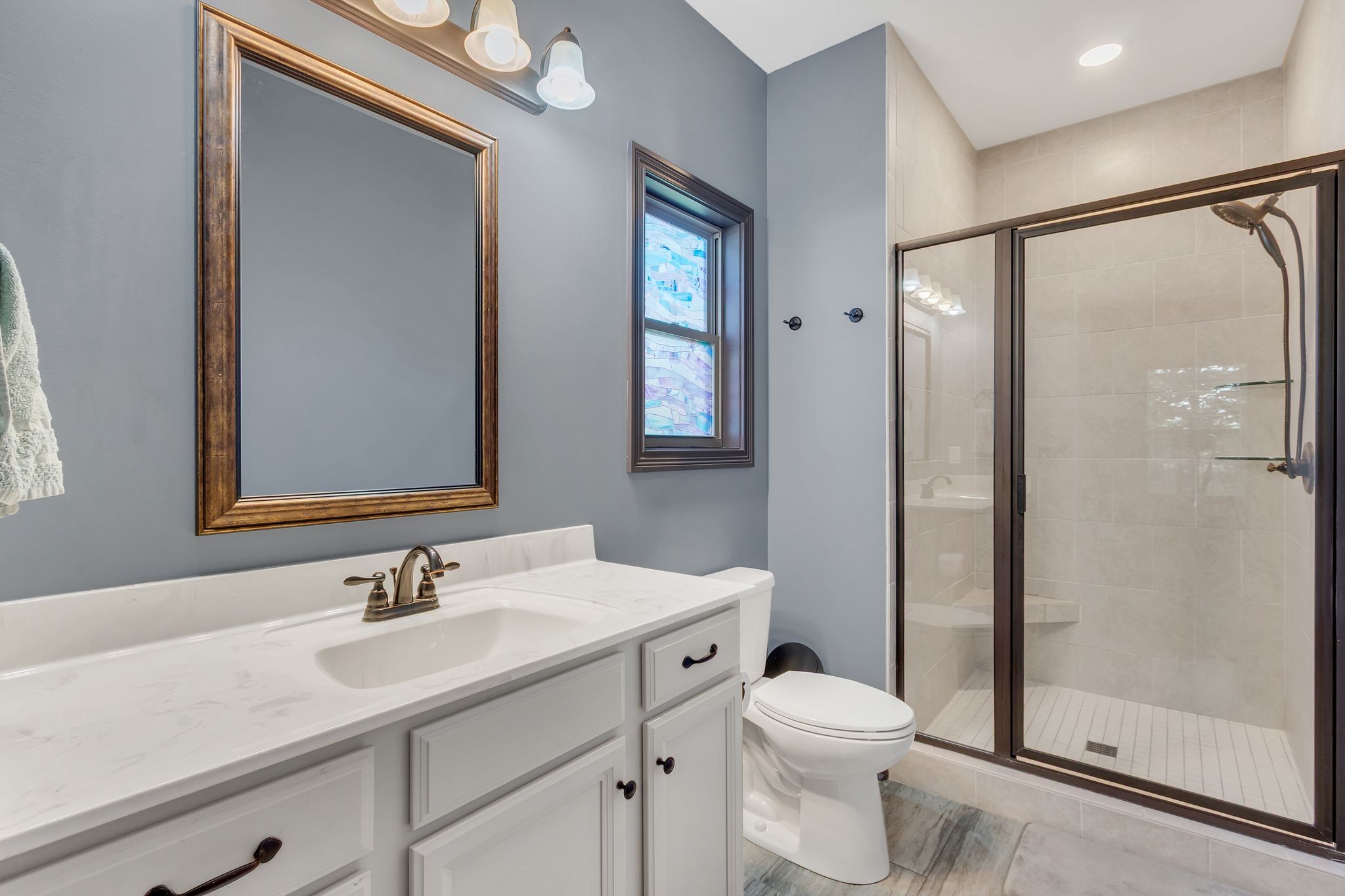 1027 Garton Road Burns, TN 37029 - Photo 25 of 36 a bathroom with a sink toilet and shower