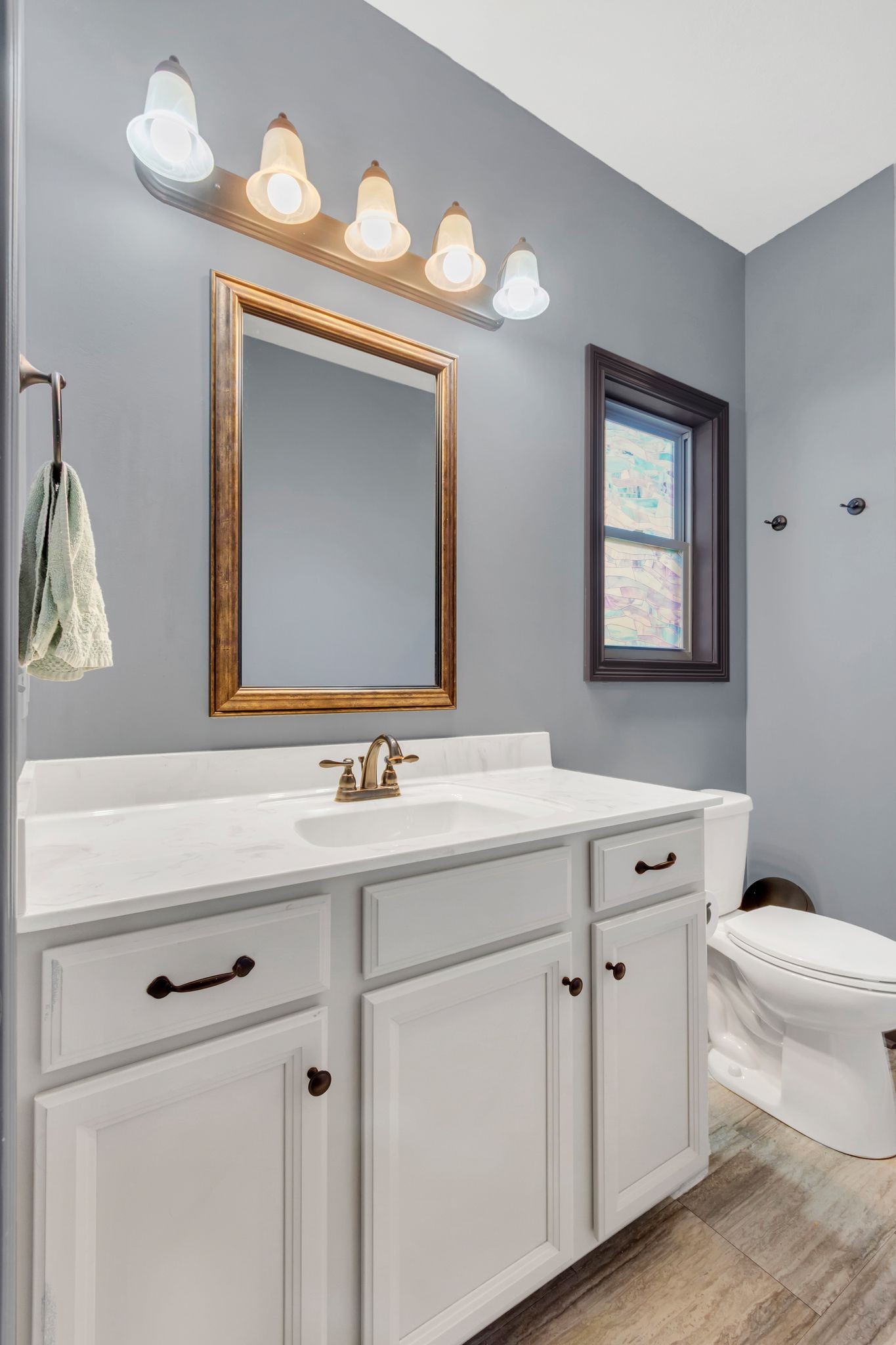 1027 Garton Road Burns, TN 37029 - Photo 26 of 36 a bathroom with a toilet sink and mirror
