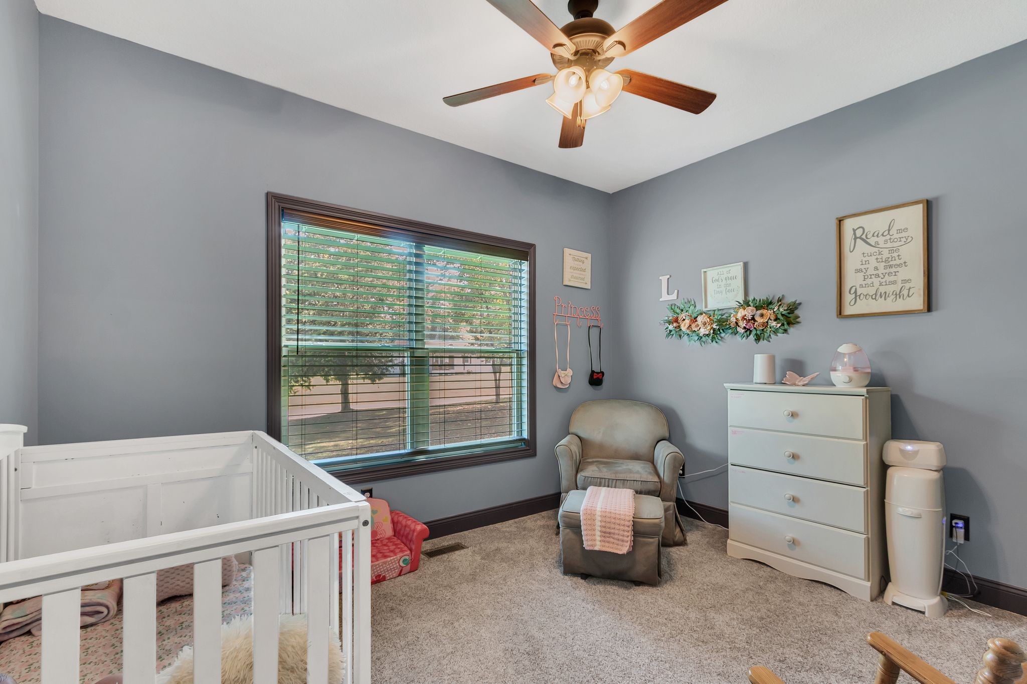 1027 Garton Road Burns, TN 37029 - Photo 28 of 36 a bedroom with a bed and a chandelier