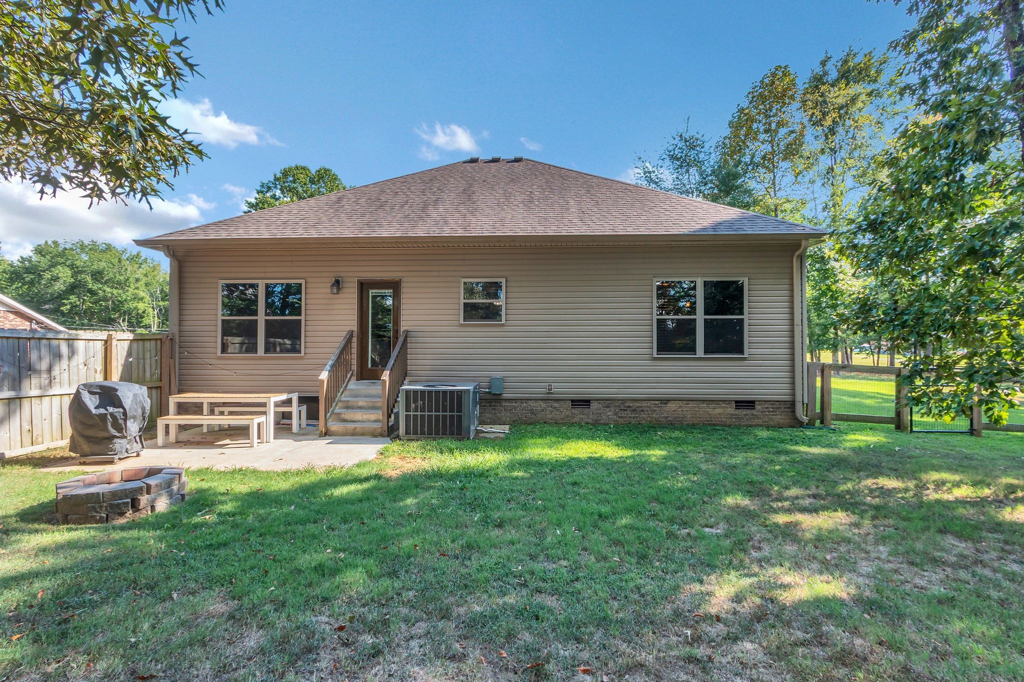 1027 Garton Road Burns, TN 37029 - Photo 34 of 36 a view of a house with a yard and sitting area