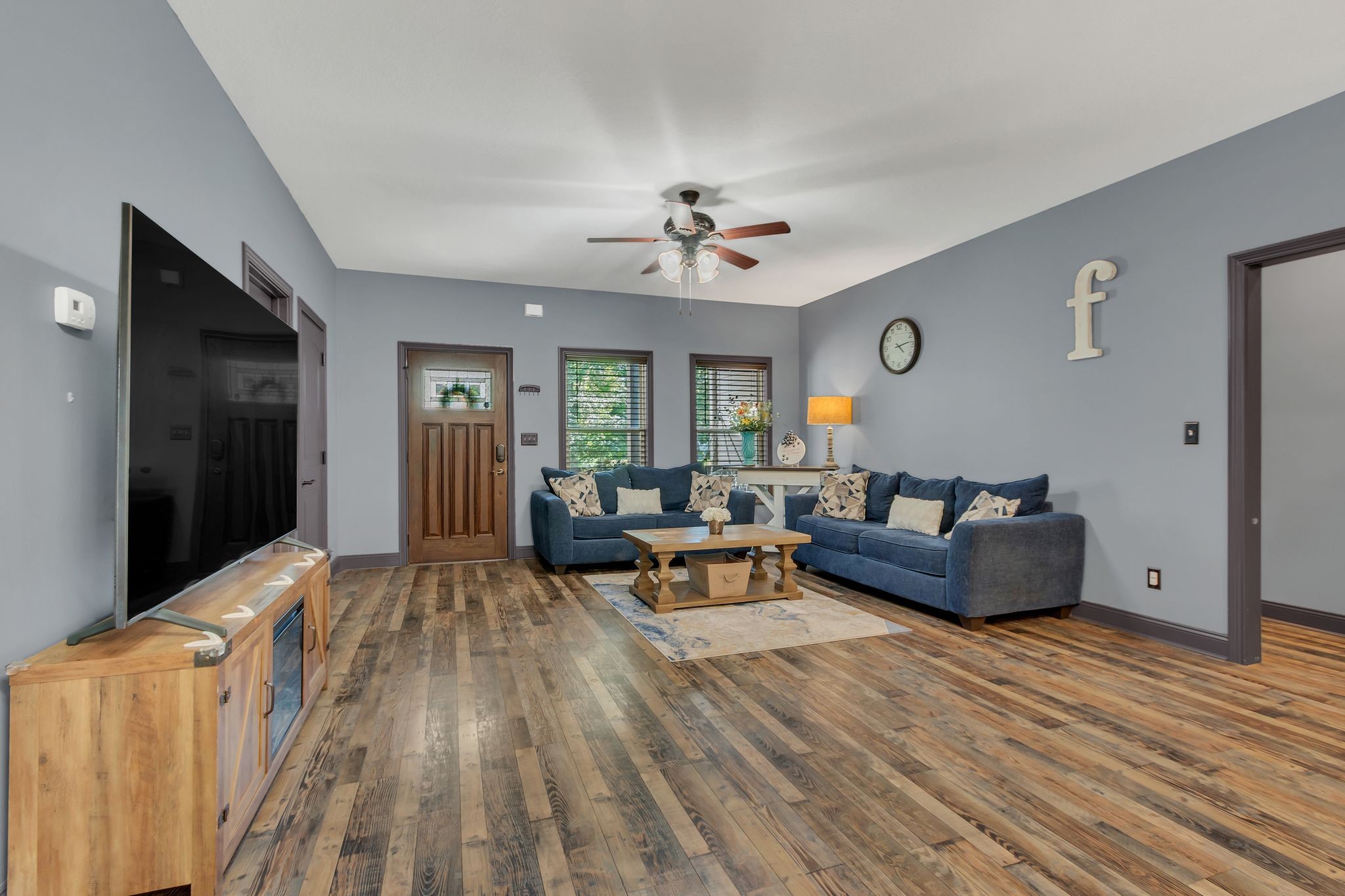 1027 Garton Road Burns, TN 37029 - Photo 9 of 36 a living room with furniture and a fireplace