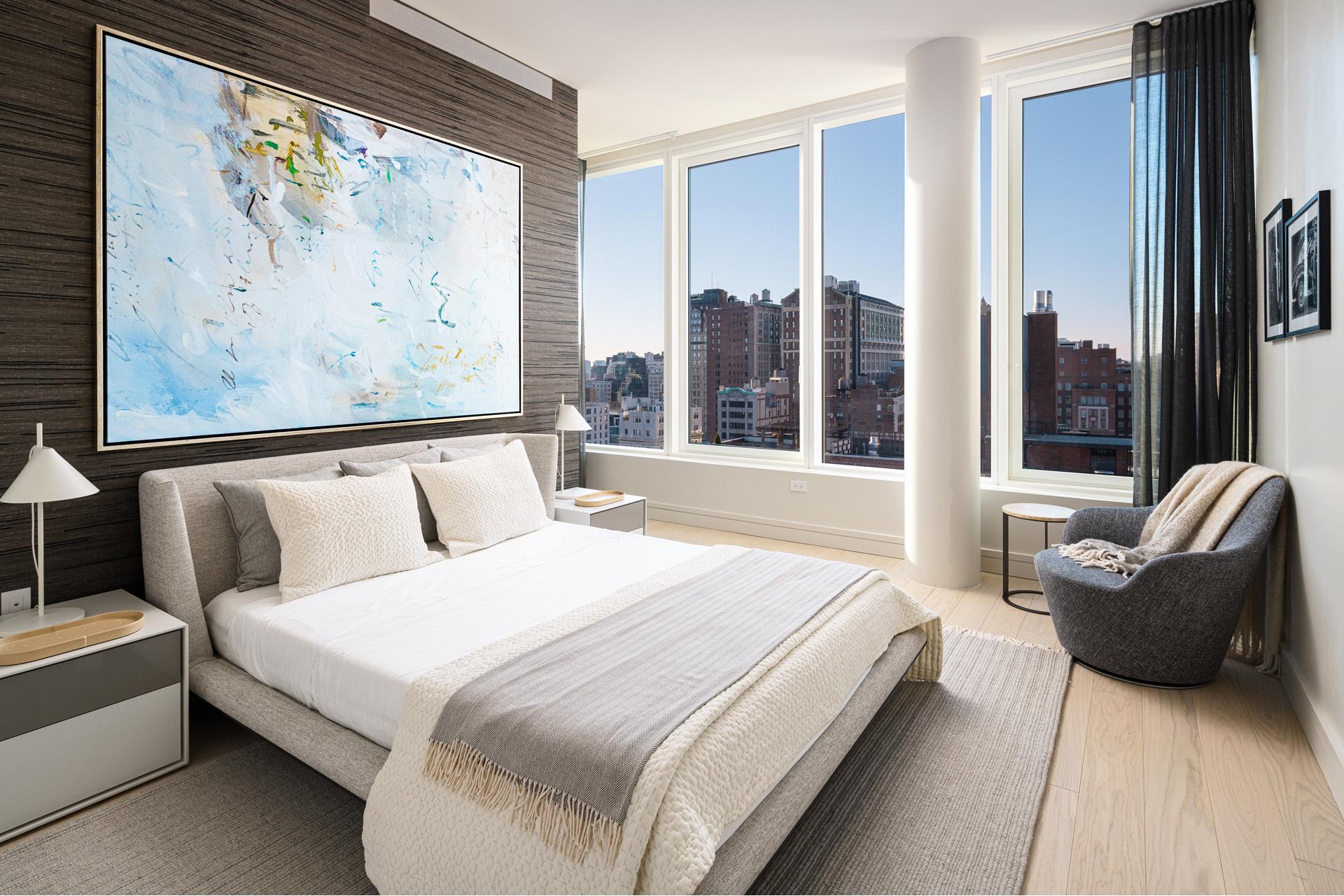 200 East 20th Street, Unit PHA Manhattan, NY 10003 - Photo 5 of 15 a bedroom with a large bed and a large window