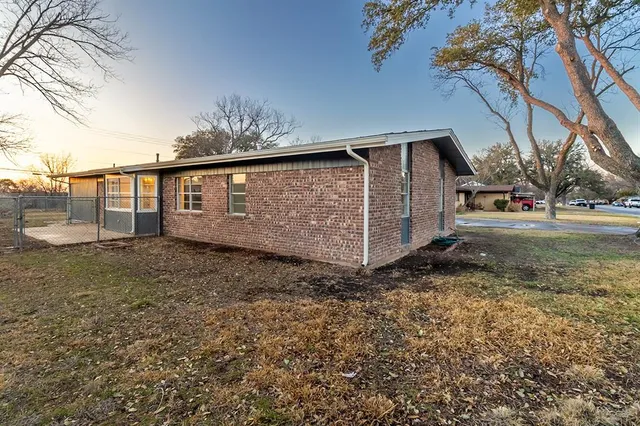 a backyard of a house with lots of green space