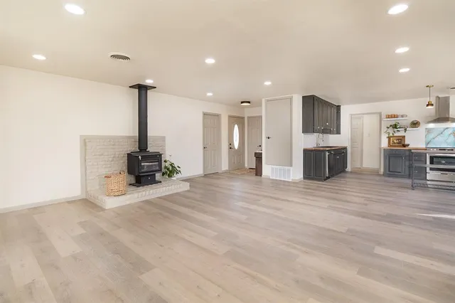 a view of kitchen with furniture and refrigerator