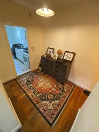 a large bed sitting in a bedroom next to a cabinet