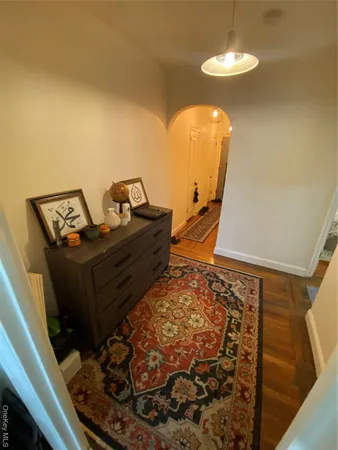 a bed sitting in a bedroom next to a lamp