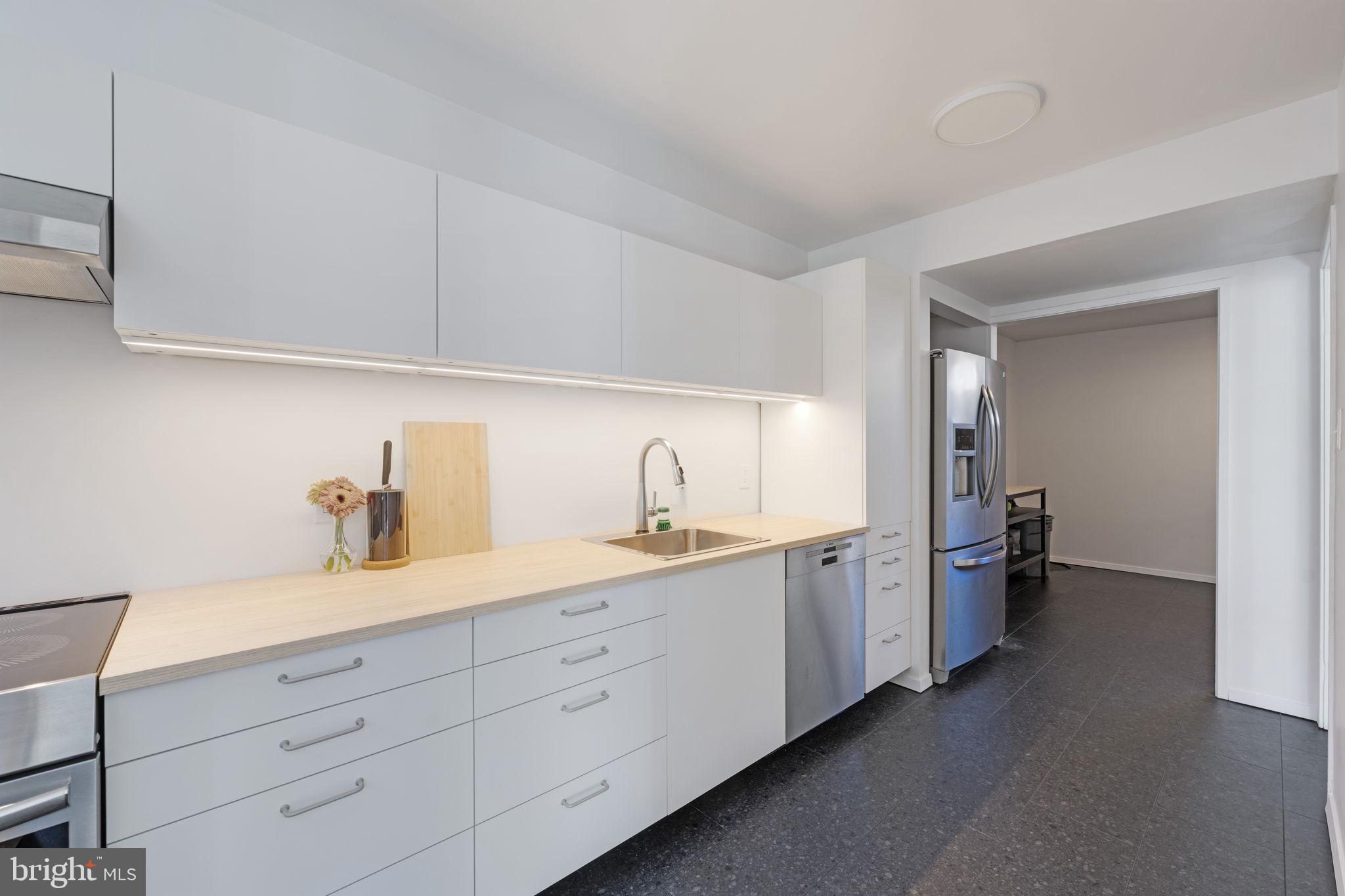 11527 Hickory Cluster Reston, VA 20190 - Photo 11 of 30 a spacious bathroom with double sink a mirror and a toilet