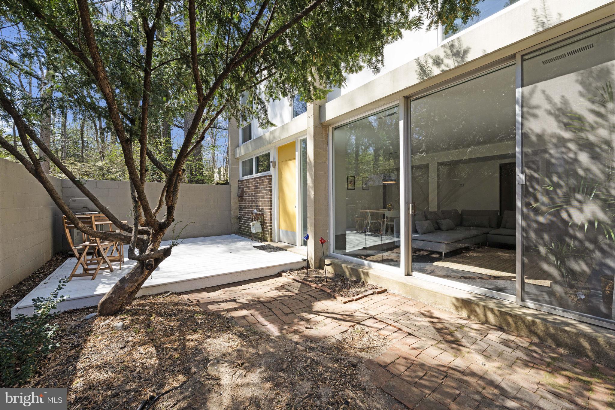 11527 Hickory Cluster Reston, VA 20190 - Photo 16 of 30 a view of a house with a yard and porch
