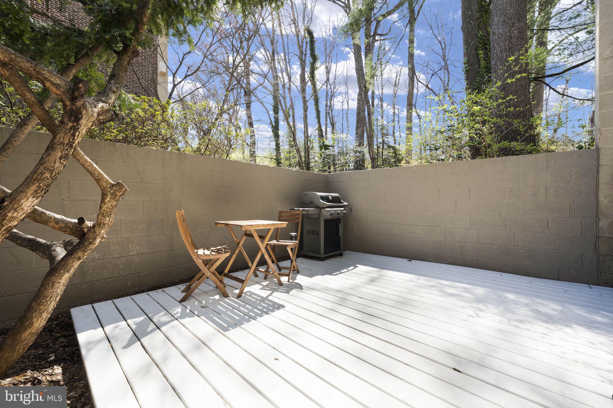 11527 Hickory Cluster Reston, VA 20190 - Photo 17 of 30 a view of a roof deck with chair and wooden floor