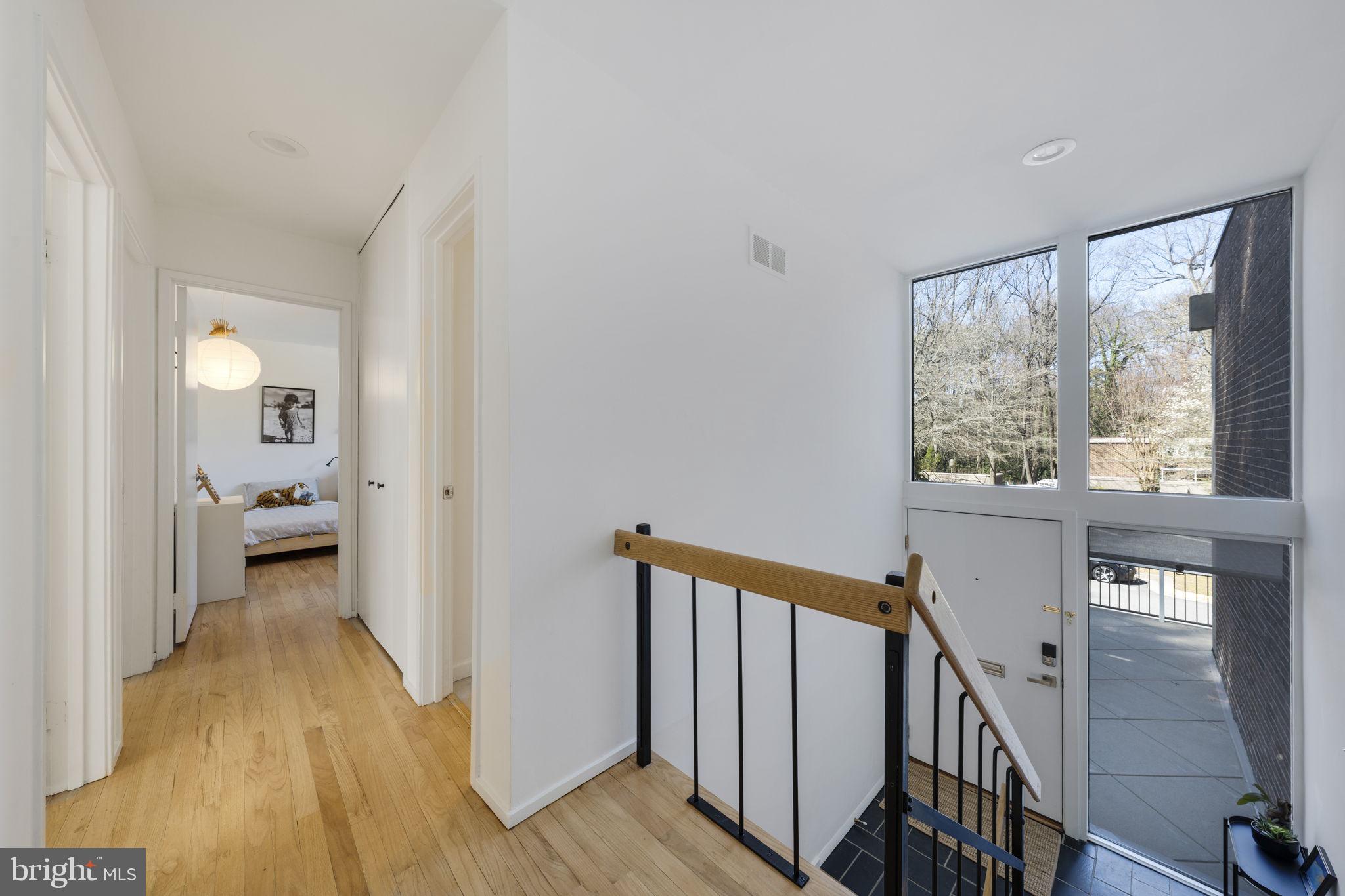 11527 Hickory Cluster Reston, VA 20190 - Photo 2 of 30 a view of a hallway with a hardwood floor and entryway