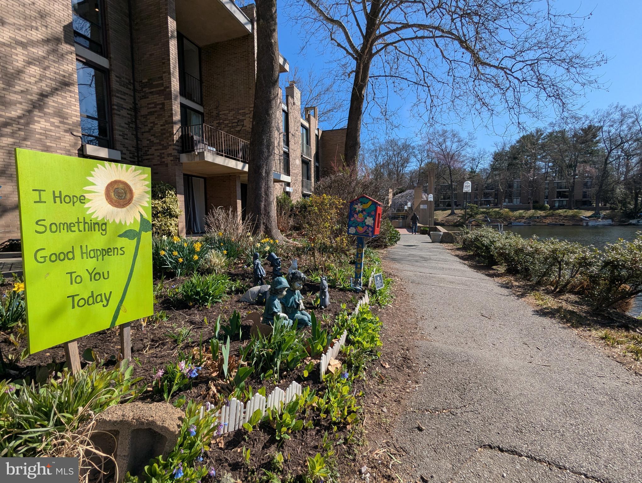 11527 Hickory Cluster Reston, VA 20190 - Photo 21 of 30 a front view of a house with a garden