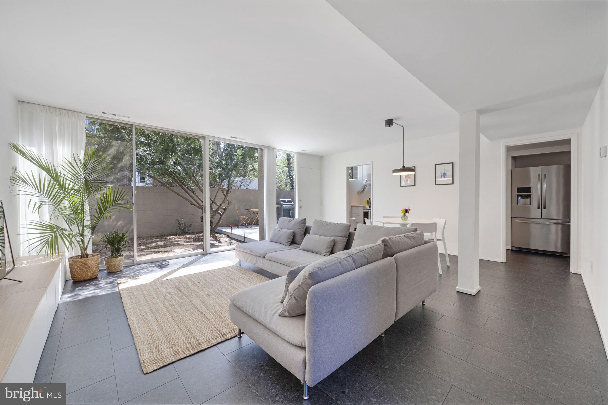 11527 Hickory Cluster Reston, VA 20190 - Photo 7 of 30 a living room with furniture and a large window