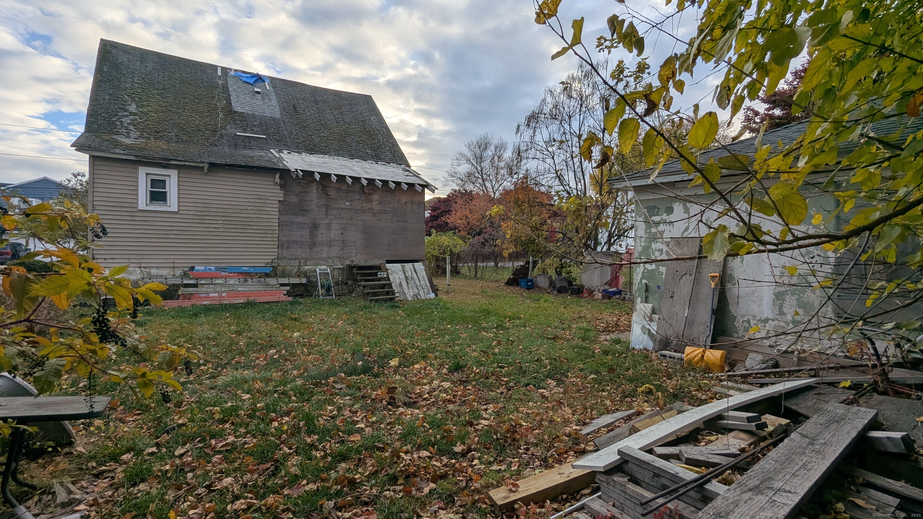 Undisclosed Address Fairfield, CT 06825 - Photo 2 of 14 a backyard of a house with lots of green space