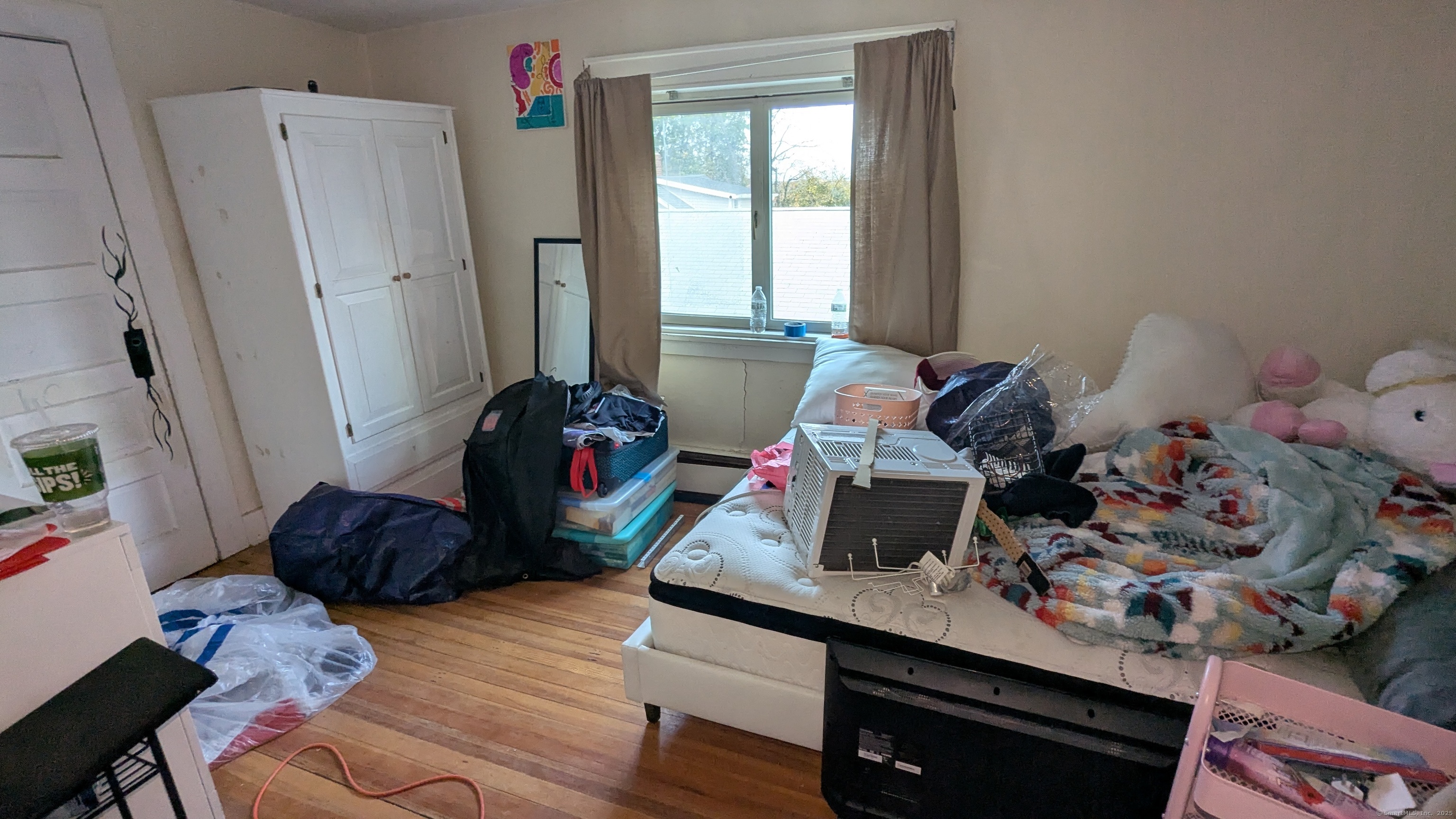 Undisclosed Address Fairfield, CT 06825 - Photo 10 of 14 a living room with furniture and a window