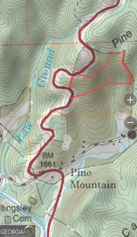 a bed with a white comforter and pillows