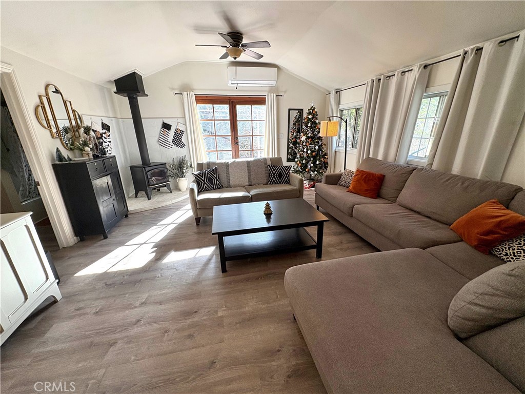 36750 Hilltop Road Yucaipa, CA 92399 - Photo 13 of 27 a living room with furniture and a flat screen tv
