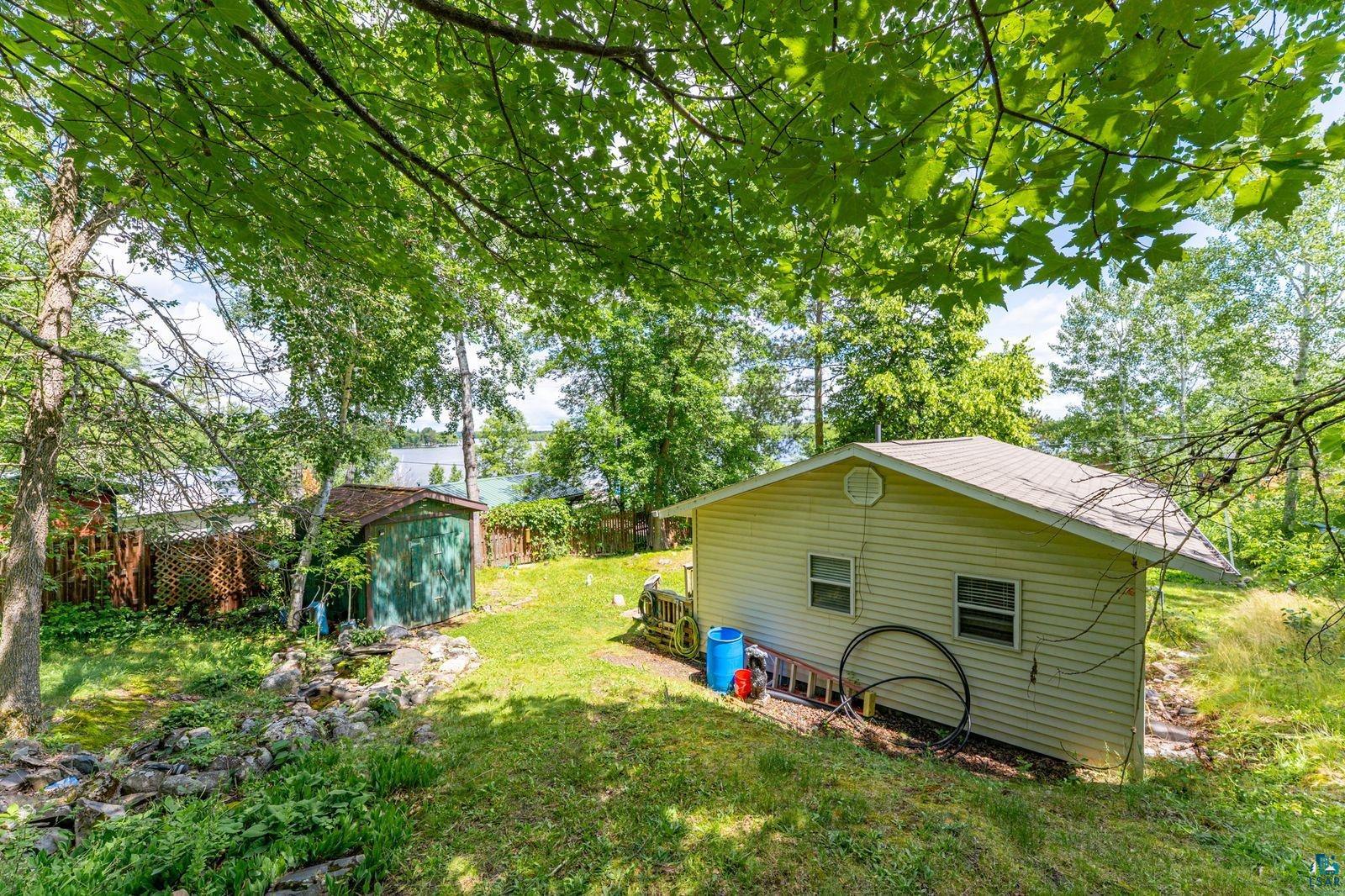 3609 Fectos Road Tower, MN 55790 - Photo 15 of 24 Fenced yard with a storage shed