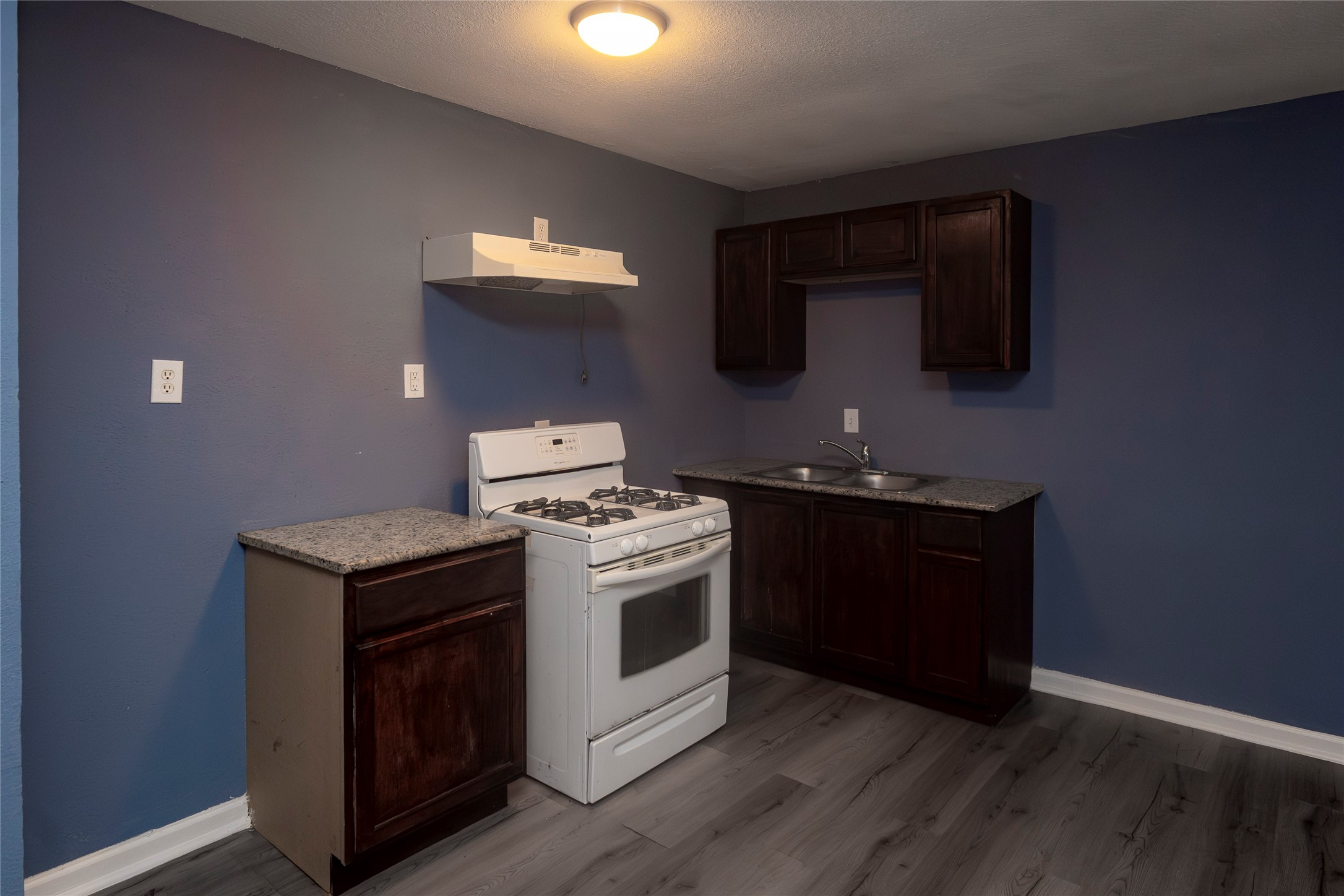716 Hargest Street, Unit B Prairie View, TX 77445 - Photo 3 of 11 a kitchen with a stove and a microwave