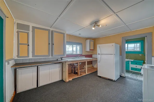 a kitchen with stove and cabinets