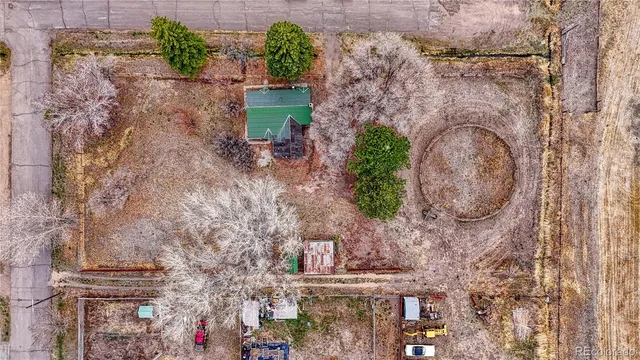 a aerial view of a house with a yard