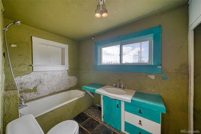 a bathroom with a shower and a toilet