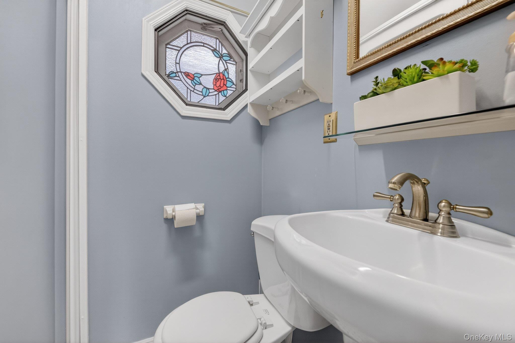 250 Rombout Avenue Beacon, NY 12508 - Photo 17 of 33 a bathroom with a toilet and a sink