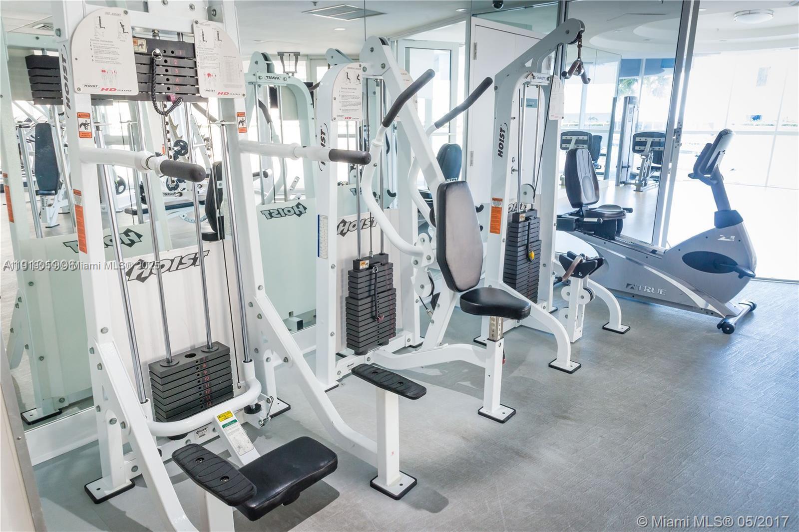 6301 Collins Avenue, Unit 2707 Miami Beach, FL 33141 - Photo 29 of 38 a view of a room with gym equipment