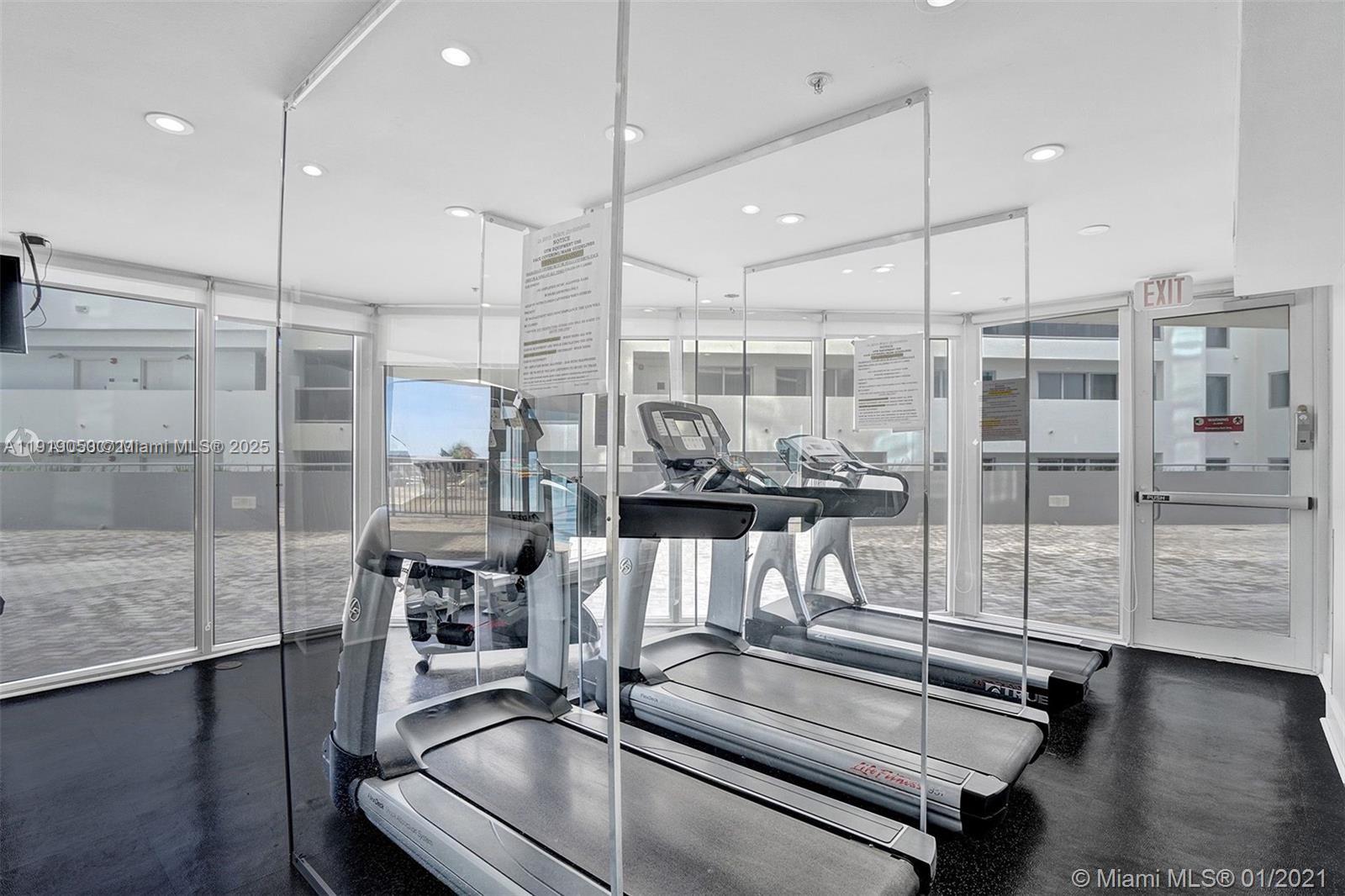 6301 Collins Avenue, Unit 2707 Miami Beach, FL 33141 - Photo 33 of 38 a view of a room with gym equipment