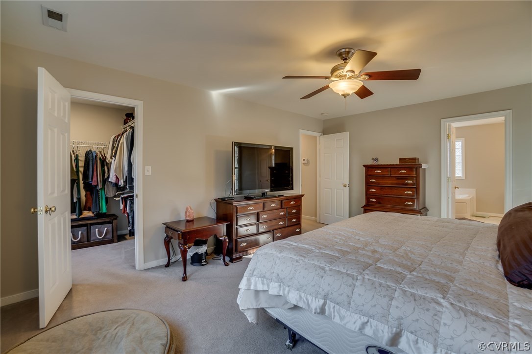14721 Nash Road Chesterfield, VA 23838 - Photo 34 of 39 a bedroom with a bed and a flat screen tv