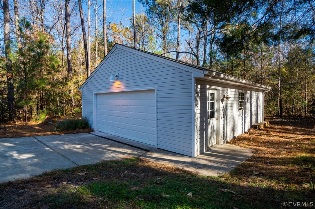 14721 Nash Road Chesterfield, VA 23838 - Photo 39 of 39 a backyard of a house with large trees and wooden fence