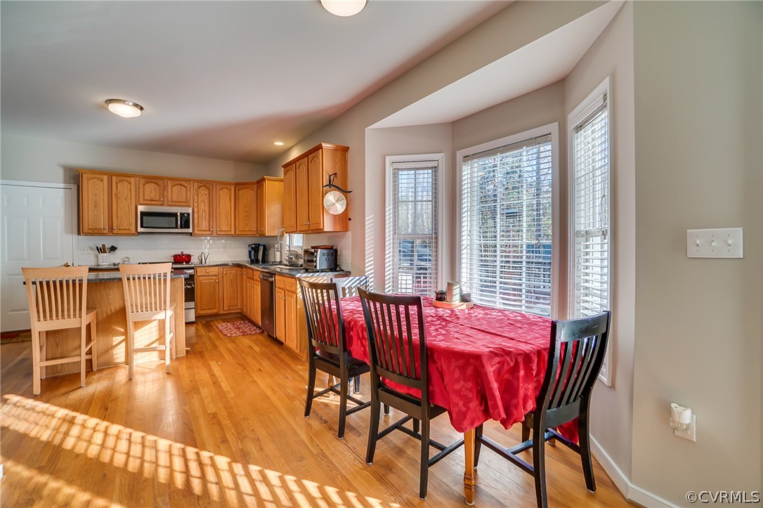 14721 Nash Road Chesterfield, VA 23838 - Photo 8 of 39 a view of a dining room with furniture and a window