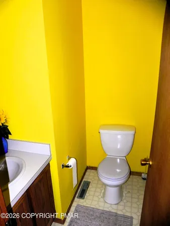 a view of a room with wooden floor and a stairs